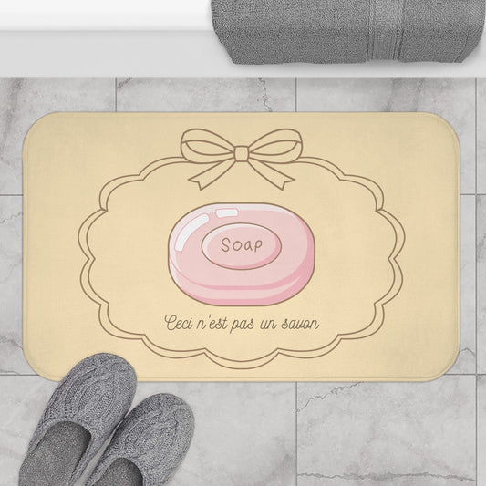 René Magritte 'Ceci n'est pas un savon' Bath Mat, NEUTRAL | Surrealist Humor Decor