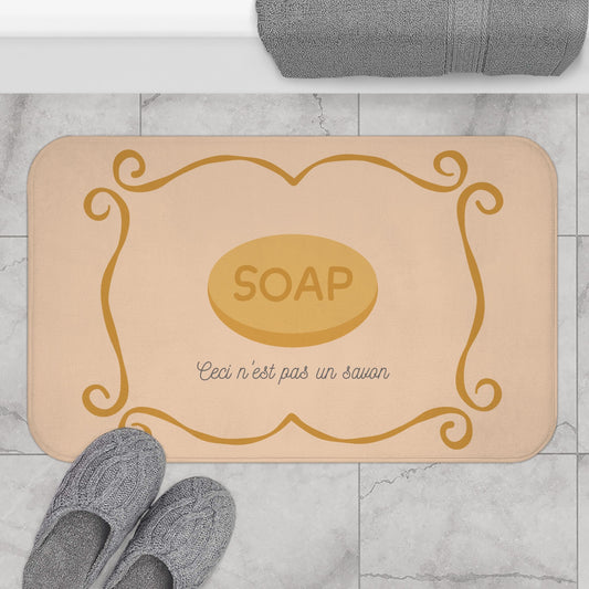René Magritte 'Ceci n'est pas un savon' Bath Mat, Light ORANGE  | Artistic Bathroom