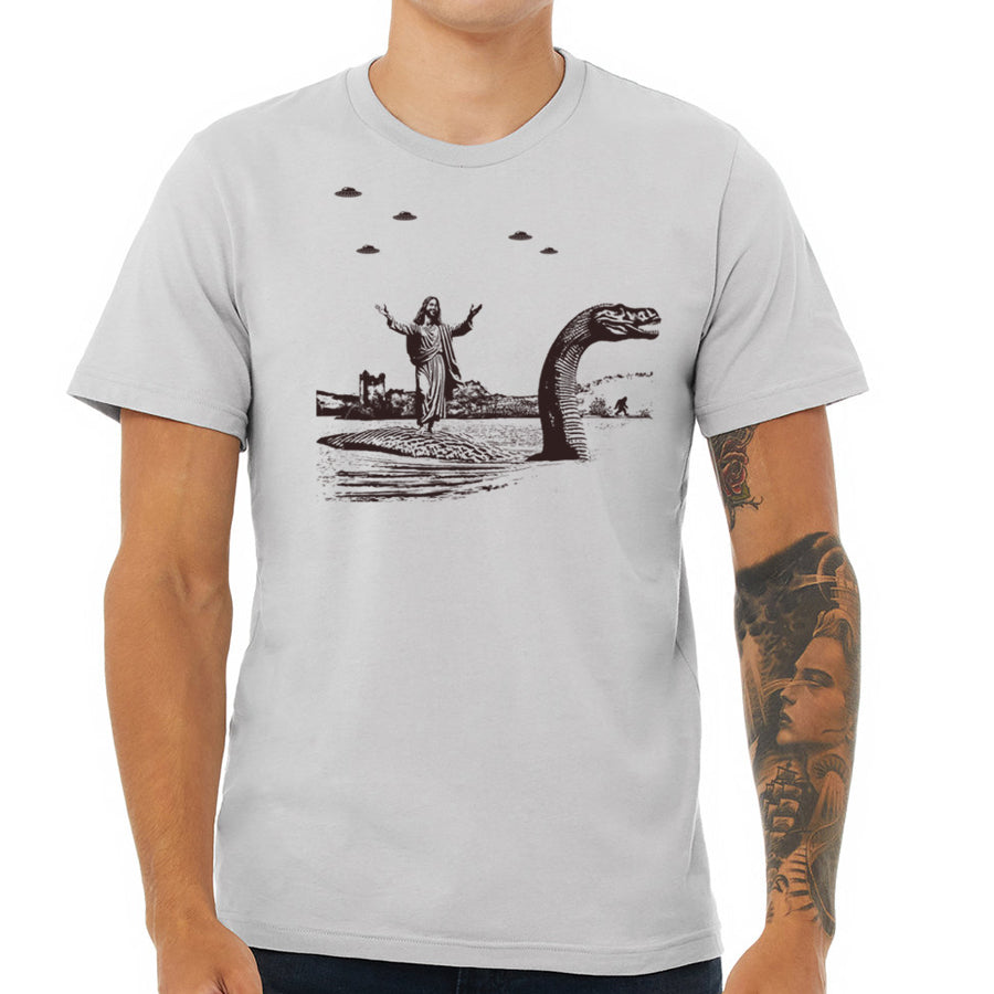 Jesus Christ Riding The Loch Ness Monster Men's Tshirt | Guys Funny Dinosaur Tee | Humorous Religious Tee with Jesus and Nessie