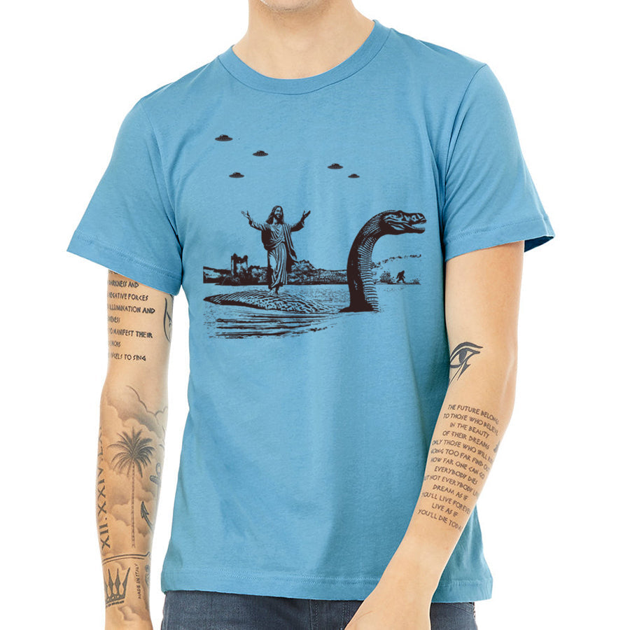 Jesus Christ Riding The Loch Ness Monster Men's Tshirt | Guys Funny Dinosaur Tee | Humorous Religious Tee with Jesus and Nessie